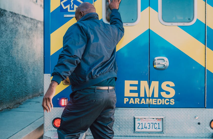 Paramedic Tapping Ambulance Door
