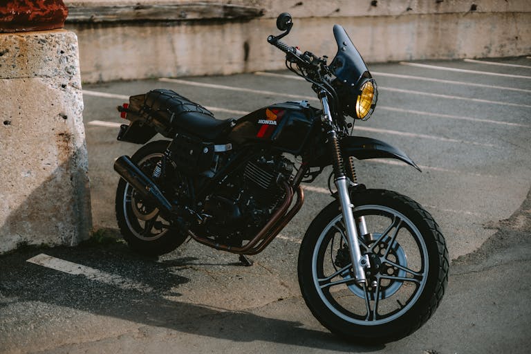 Vintage 1982 Honda Bike with concrete background.
