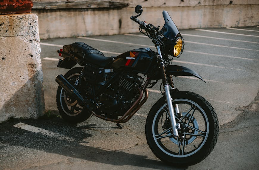 Vintage 1982 Honda Bike with concrete background.
