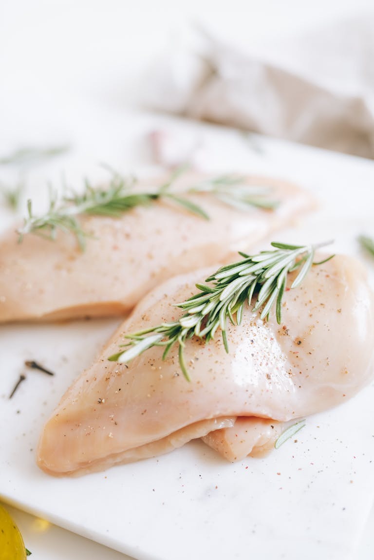 Herbs on Raw Chicken Breasts